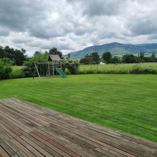 Children’s Playground at Plain Champagne Kids playground at Plain Champagne Guest Farm with swings and slide set in a large open grass area